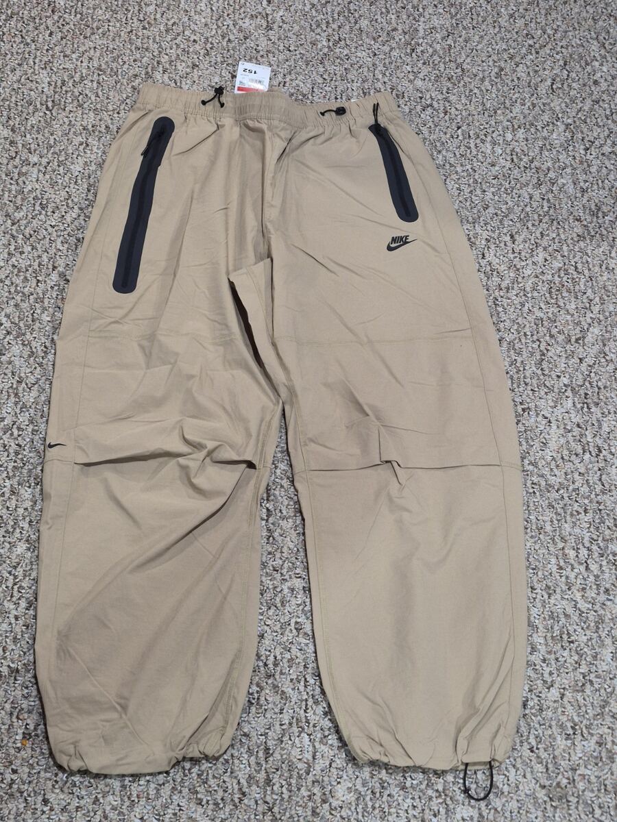 Nike Men's Tech Woven Oversized Pants in a khaki or parachute beige color